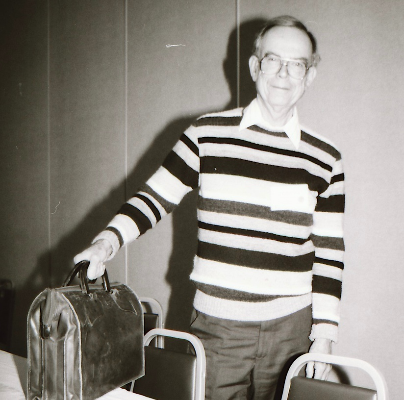 Black and white photo of George B. Fell holding a briefcase.