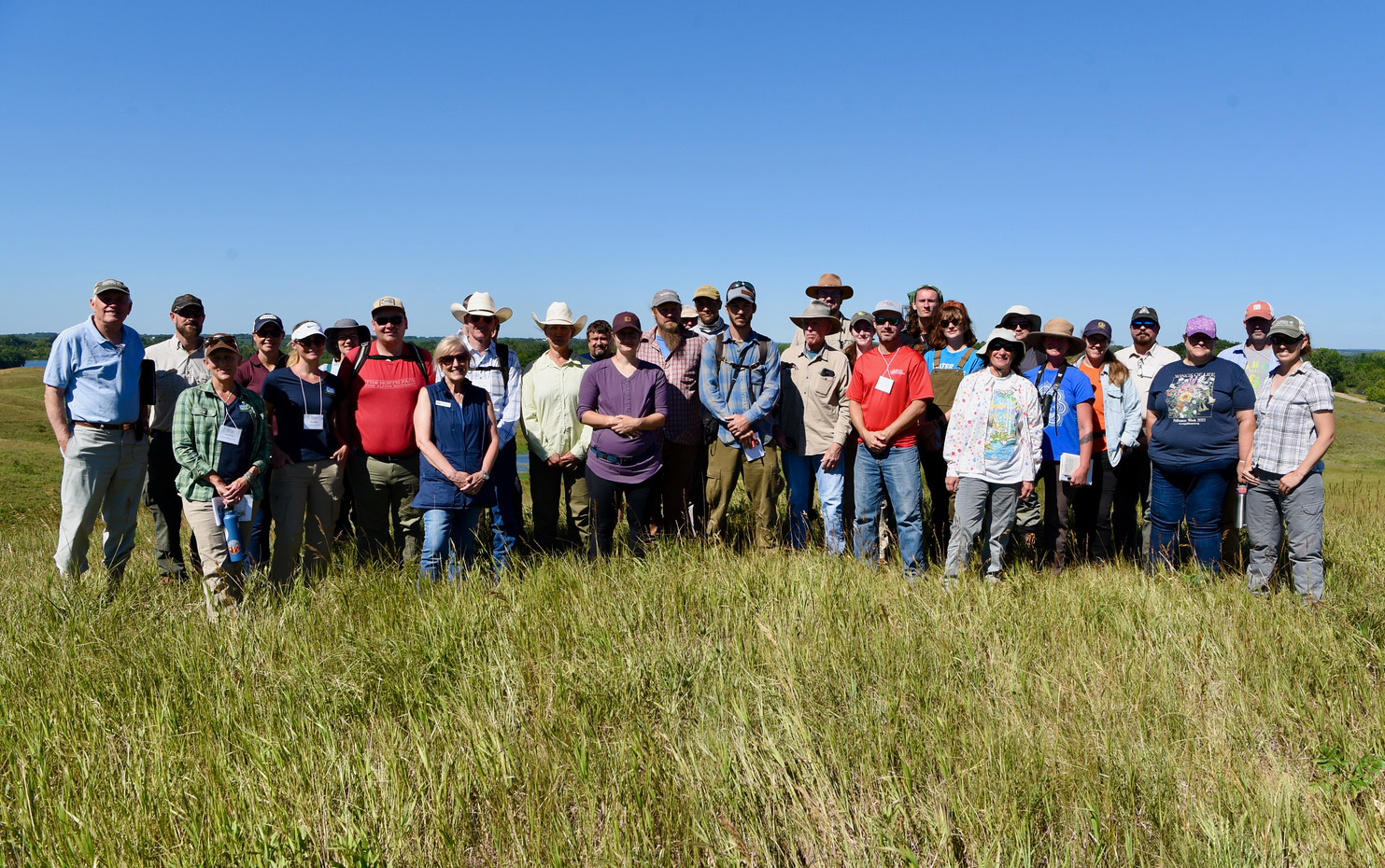Group of NAA members in a grassy field.